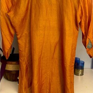 Long sleeves, gold like metallic color, sheer